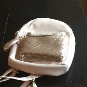 A cute pink and rose gold mini backpack